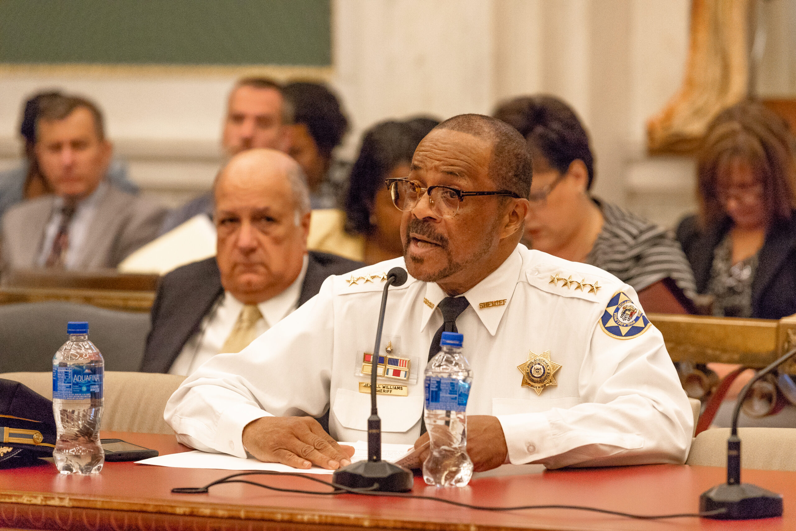 police captain speaking in front of a judge